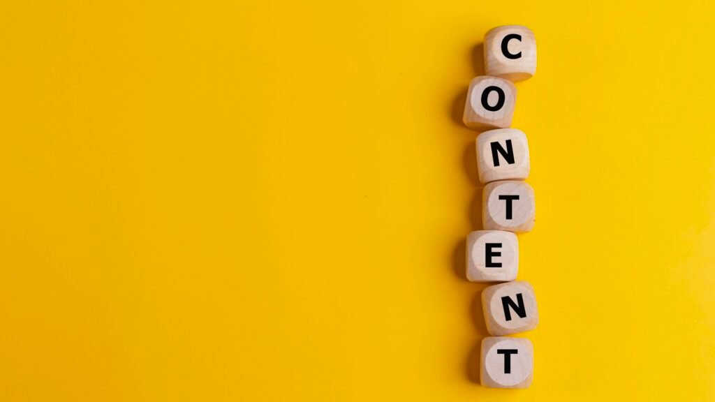 Cubes with the word CONTENT on a yellow background.Content creation