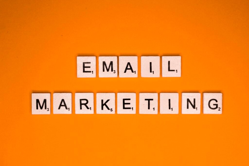 Email marketing scrabble letters word on a orange background